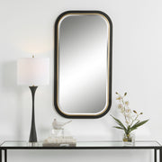 Uttermost Nevaeh 09880 black and gold modern rectangle bathroom vanity mirror with curved satin black frame and gold leaf inner edge, 23 in. W x 43 in. H