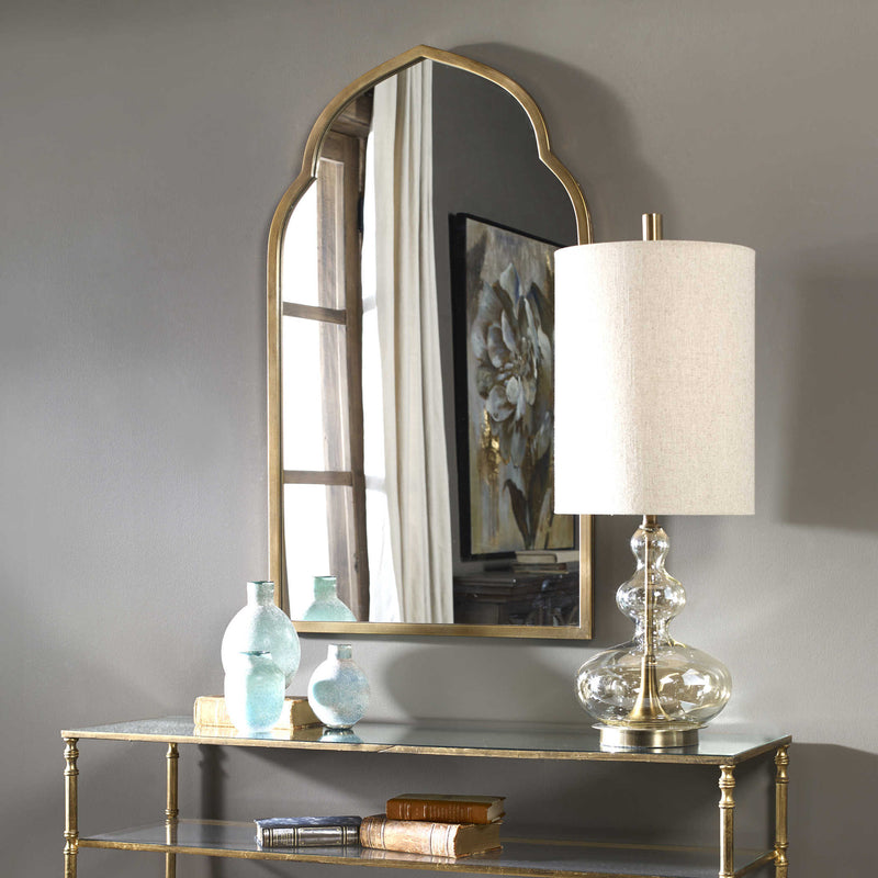 Uttermost Kenitra Gold Arch Mirror styled in a transitional entryway.